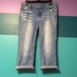 Lightly distressed denim capris